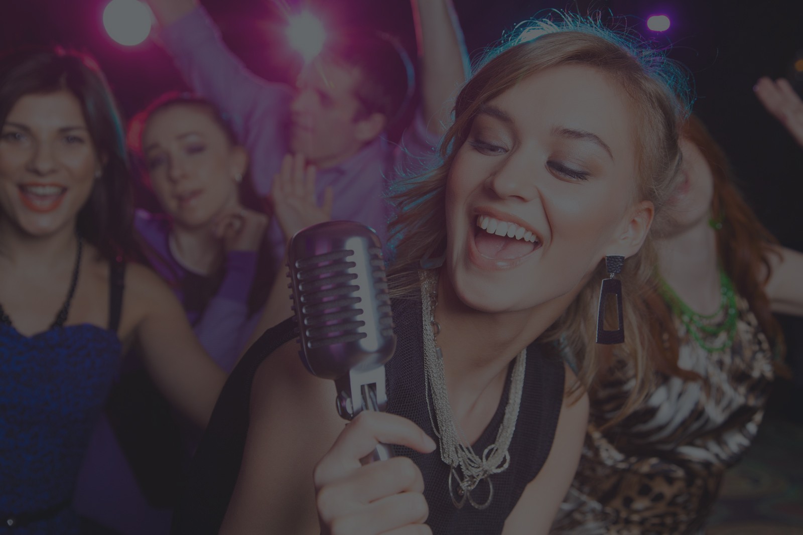 A group singing karaoke at Cowboy Thai
